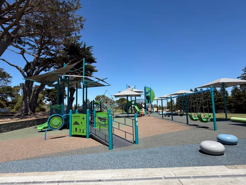 Little kid play structure, special swings, and large kid zone in back