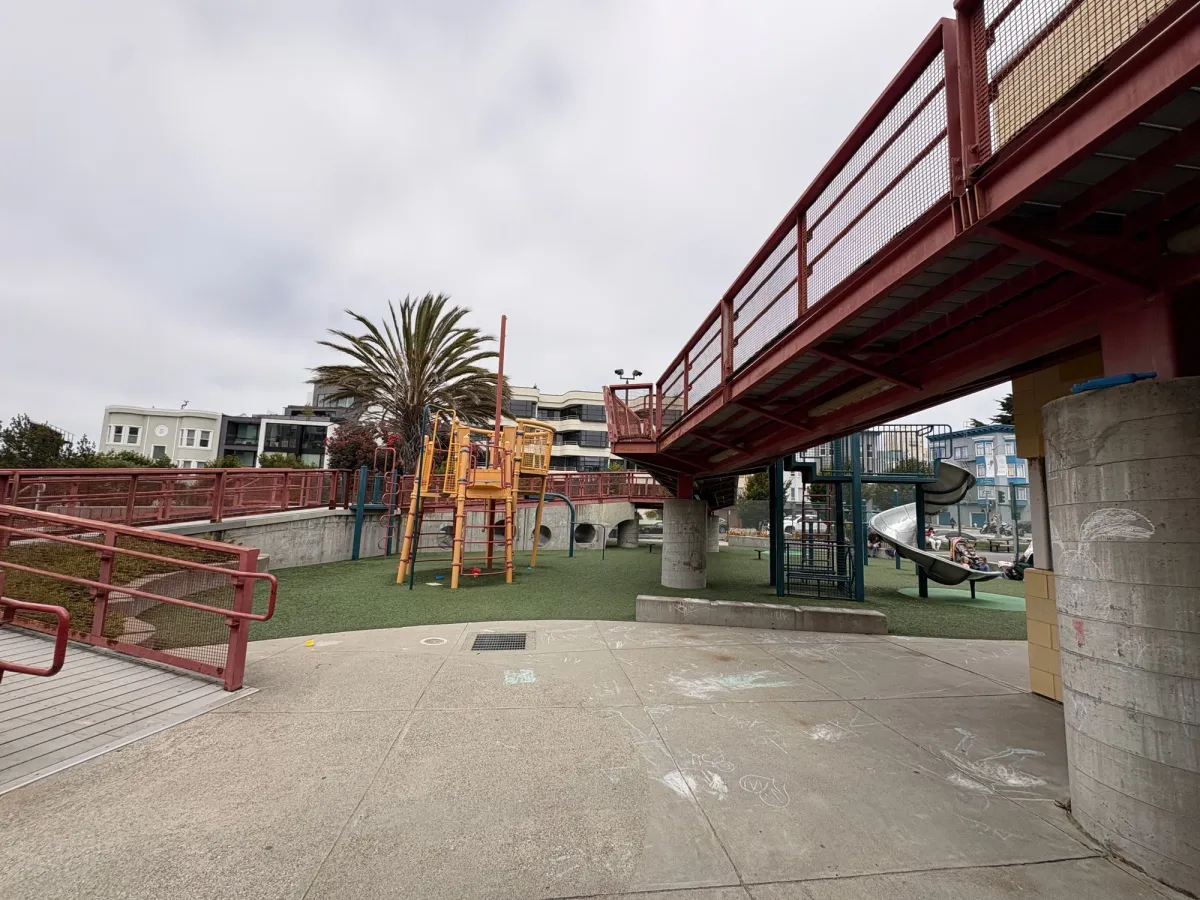Center playground structure and wrap around bi-level bridge?
