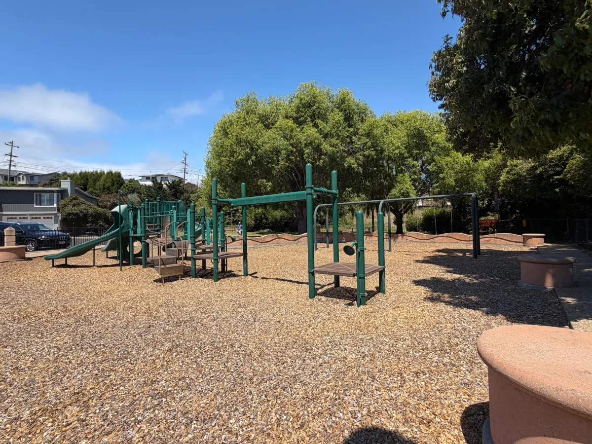 Play structure that has in-between sizing for toddler and older kids. Likely not enough to do to keep either age group entertained for long. 