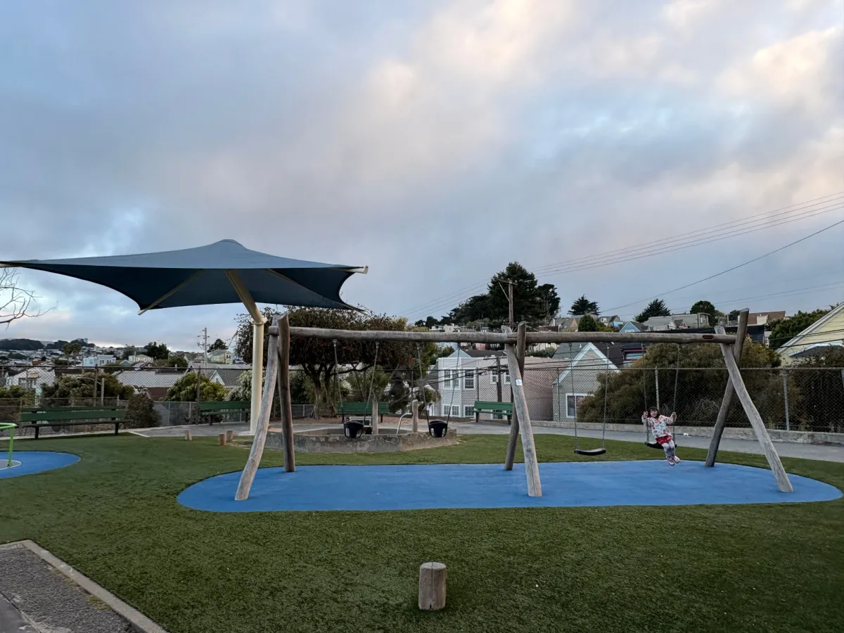toddlers and babies swing together