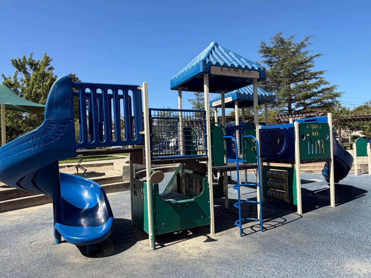 Playground structure with 2 slides, and playhouse underneath