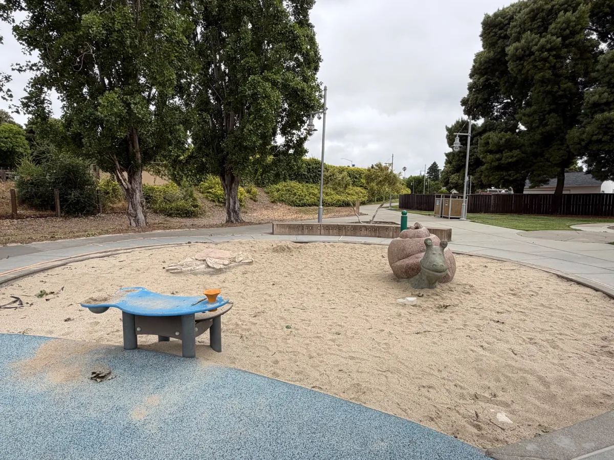 Sandpit has a crab, snail, and sand table
