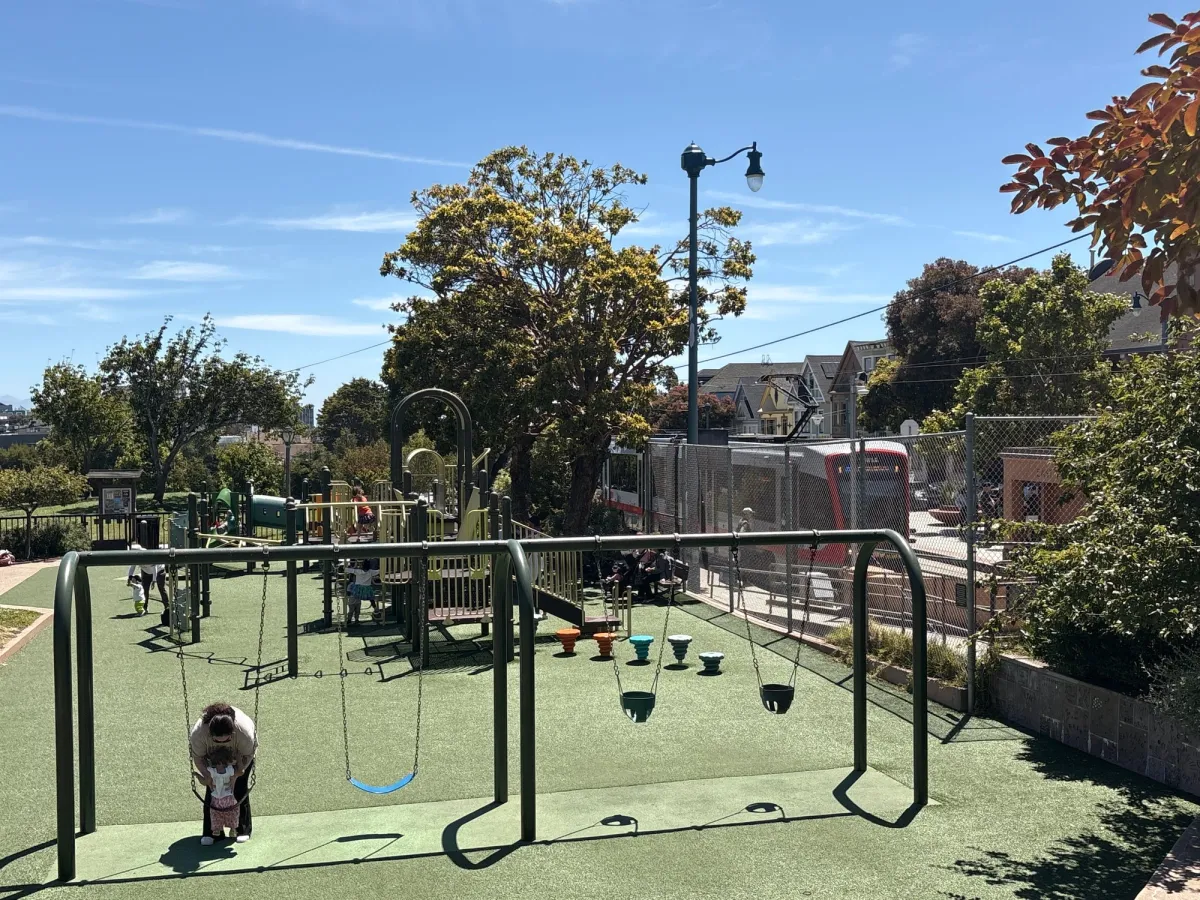 The N train runs right along the playground
