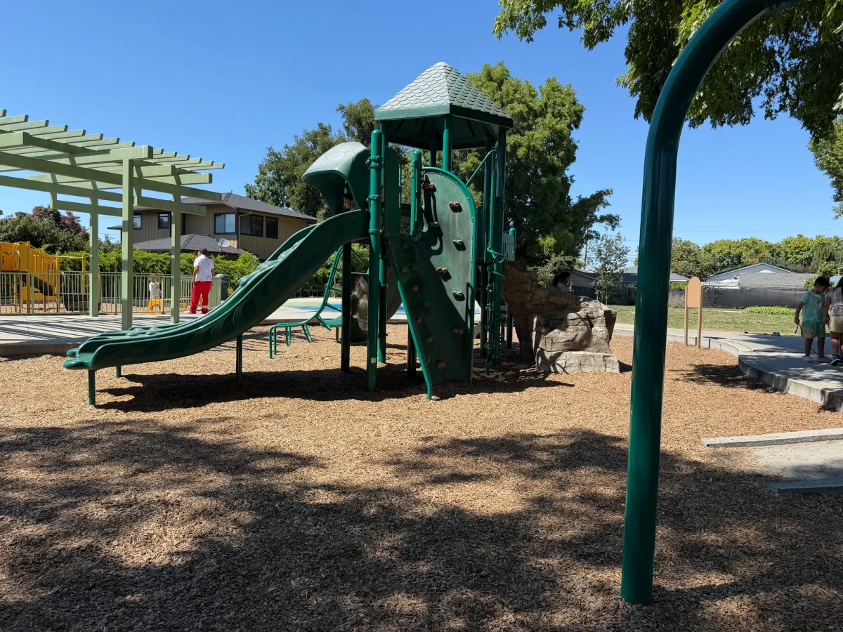 Climbing wall and slide on big kid play gym