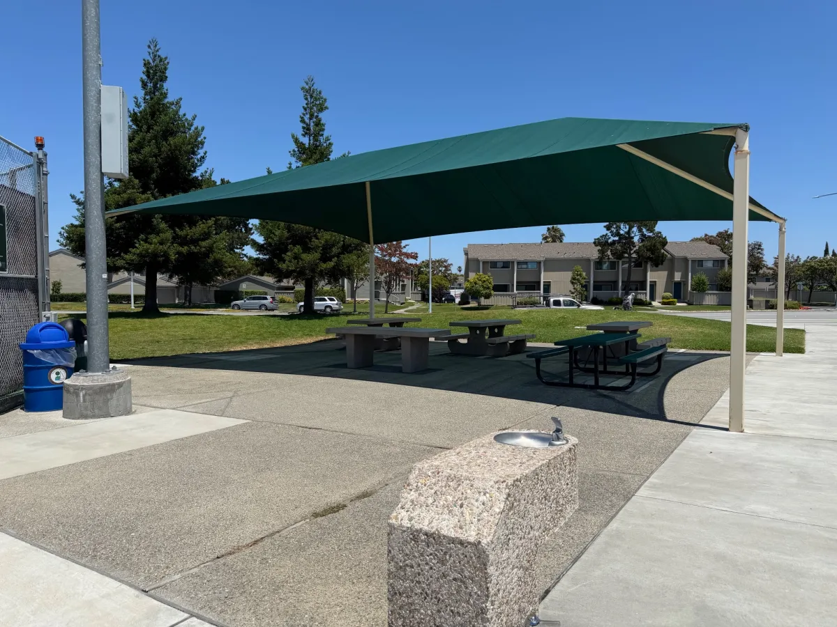 More shaded picnic tables next to tennis courts - unfortunately not reservable