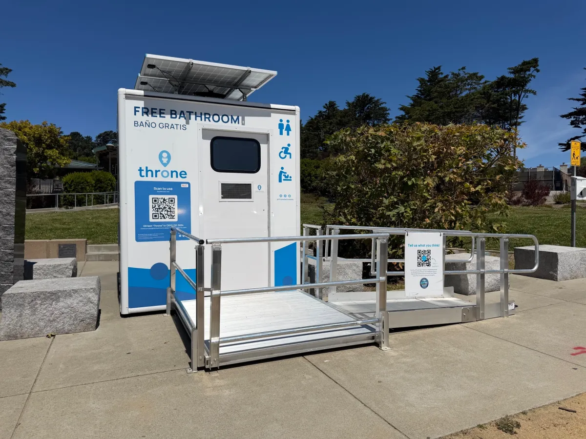 Very clean, portable bathroom right in front of parking lot - comes with changing table! 