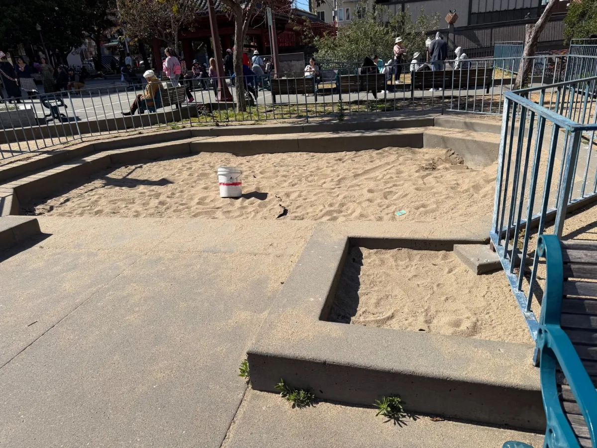 Sand box to the side for toddler play