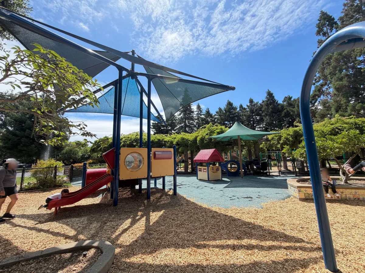 Large shade coverings over toddler play area