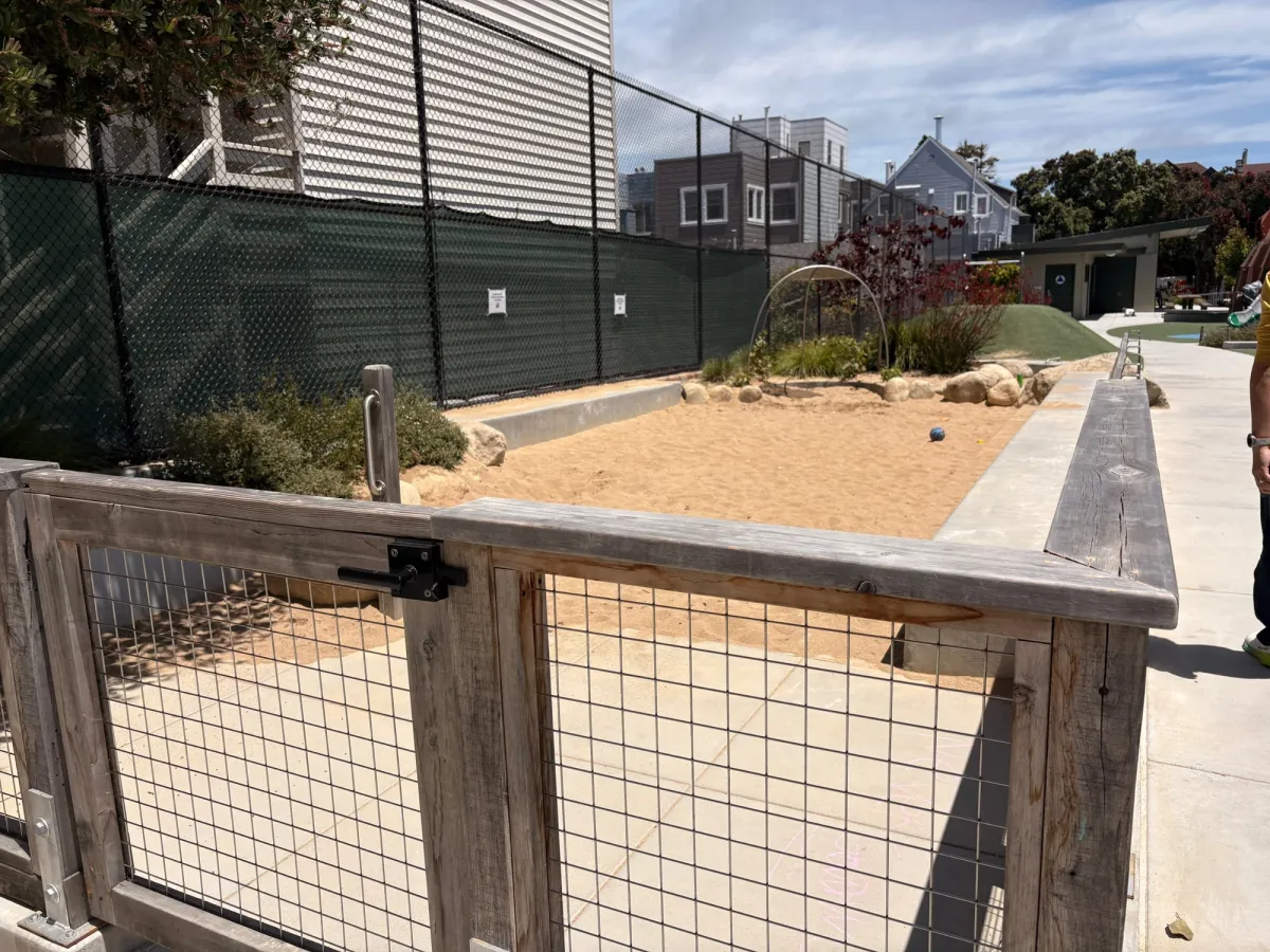 Enclosed sand pit, complete with a gate