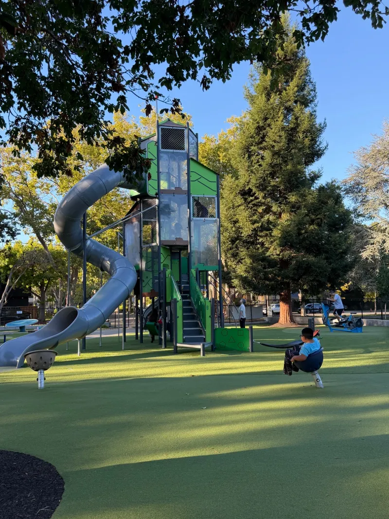 Tall big kid slide and spinners below