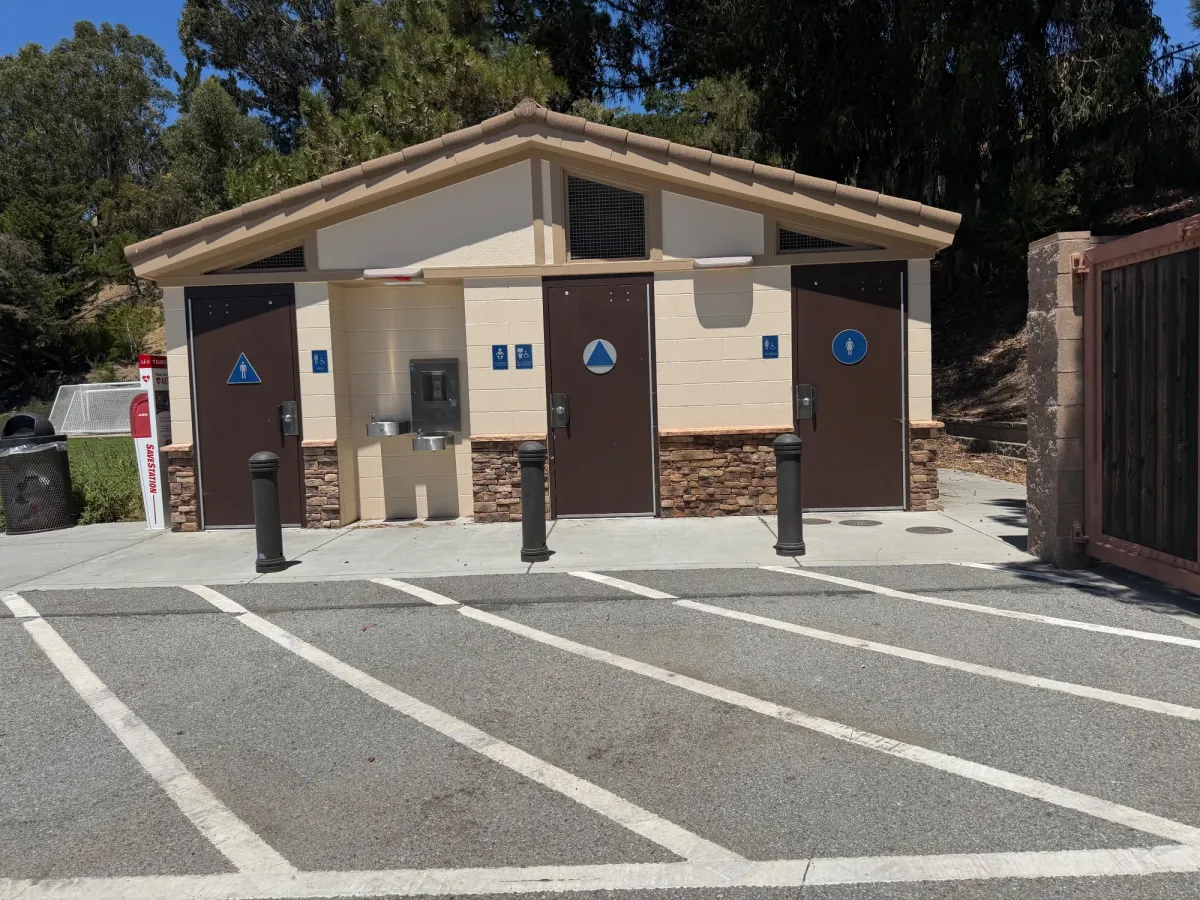 Bathroom exterior next to parking lot