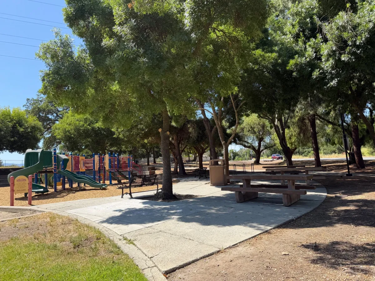 Playground overview with picnic tables to the side