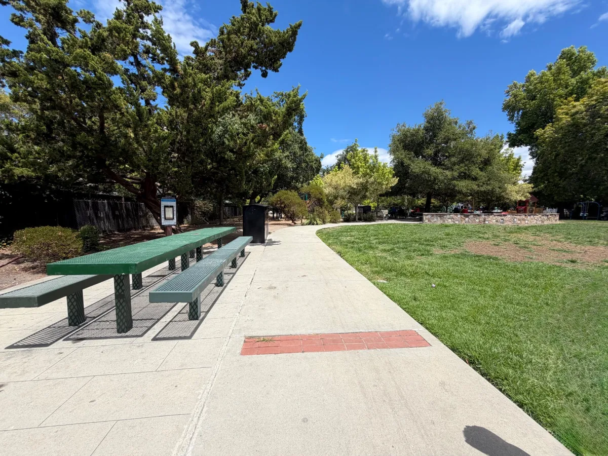 Fully enclosed playground also offers an extra large picnic table seating near entrance