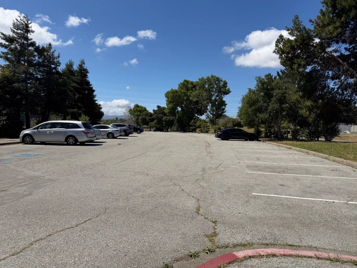 Large parking lot directly behind playground. There is another parking lot on the other side