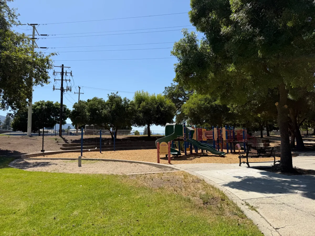 Playground with bleacher seating to the back