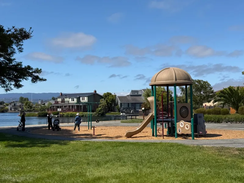 Toddler play area with gorgeous view of the water and planes flying overhead