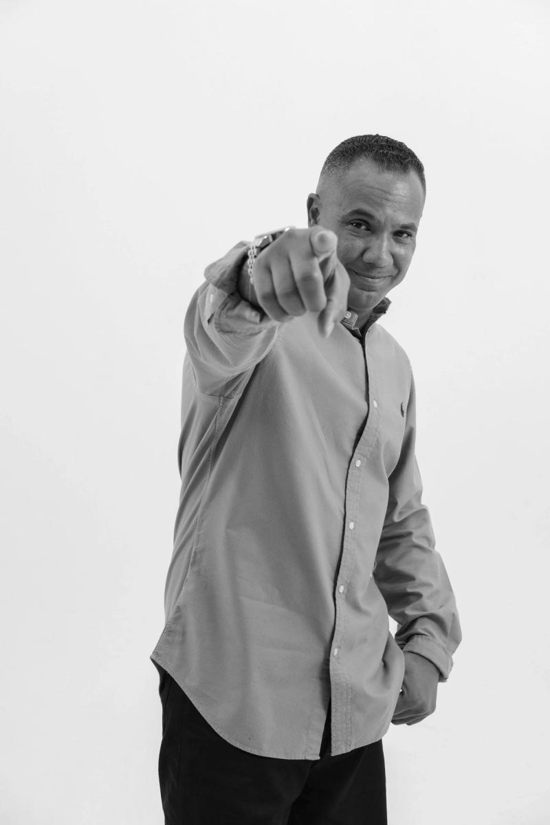 Man pointing at the camera with a big smile