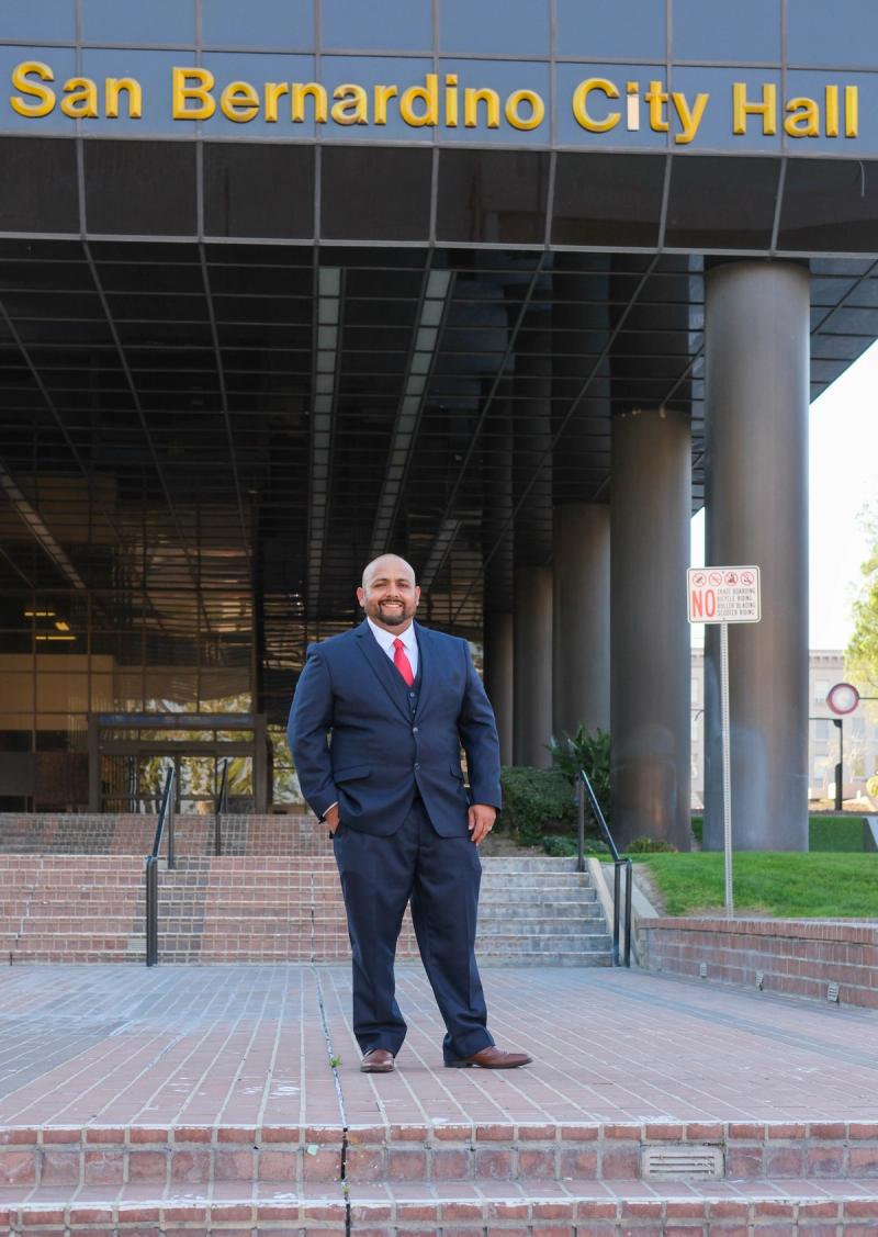 Candidate standing in front of San Bernardino City Hall