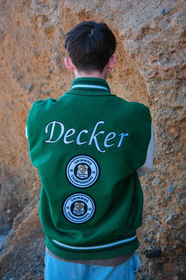 Back of a letterman jacket embroidered with the name Decker
