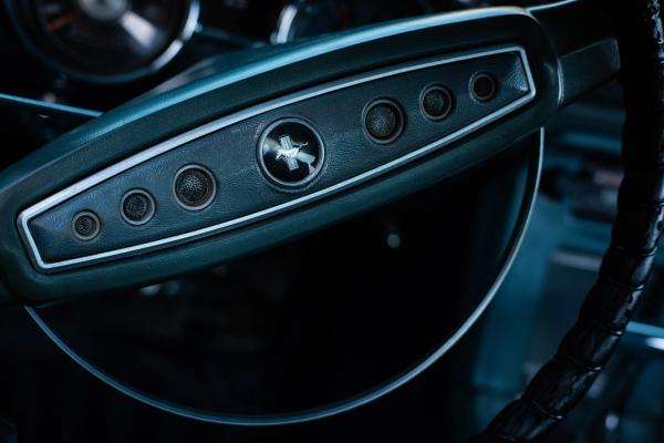 Detail of a classic Mustang steering wheel and dash