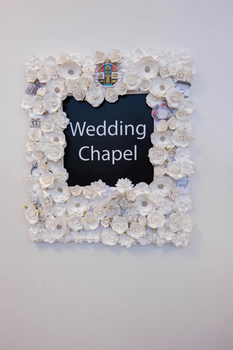 Wedding Chapel sign framed in white paper flowers