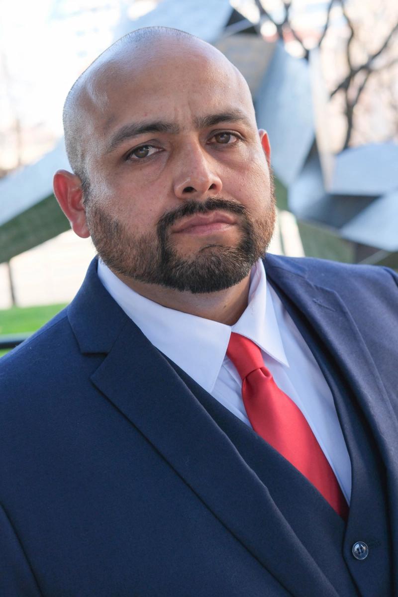 Serious close portrait of a candidate in a navy suit