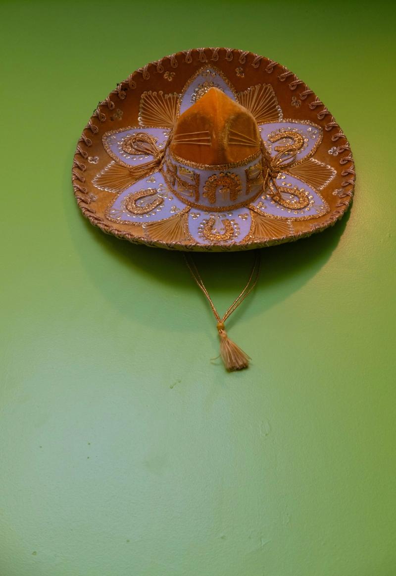 Decorative sombrero on a bright green wall