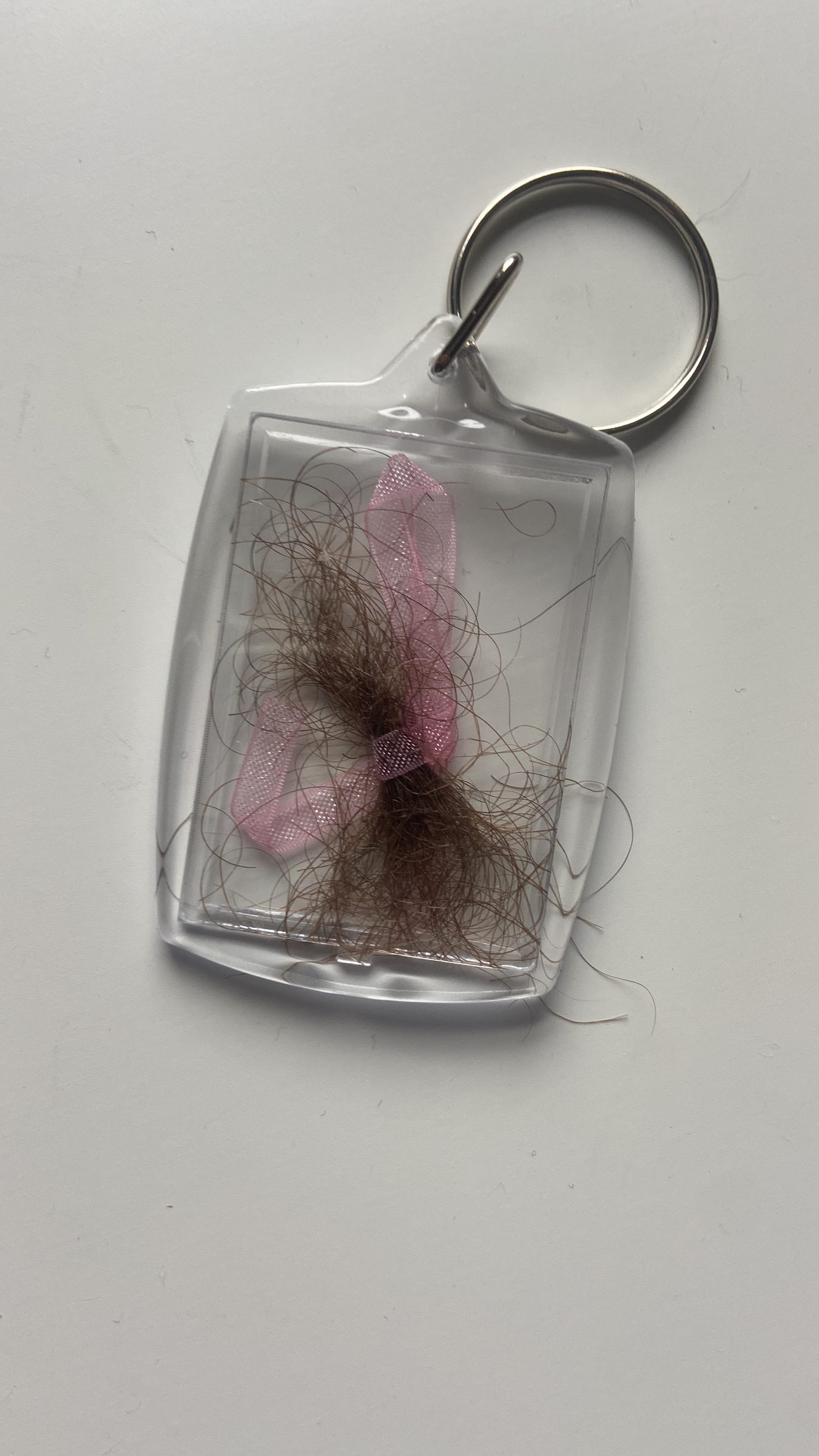 Commemorative keyring, hair and ribbon