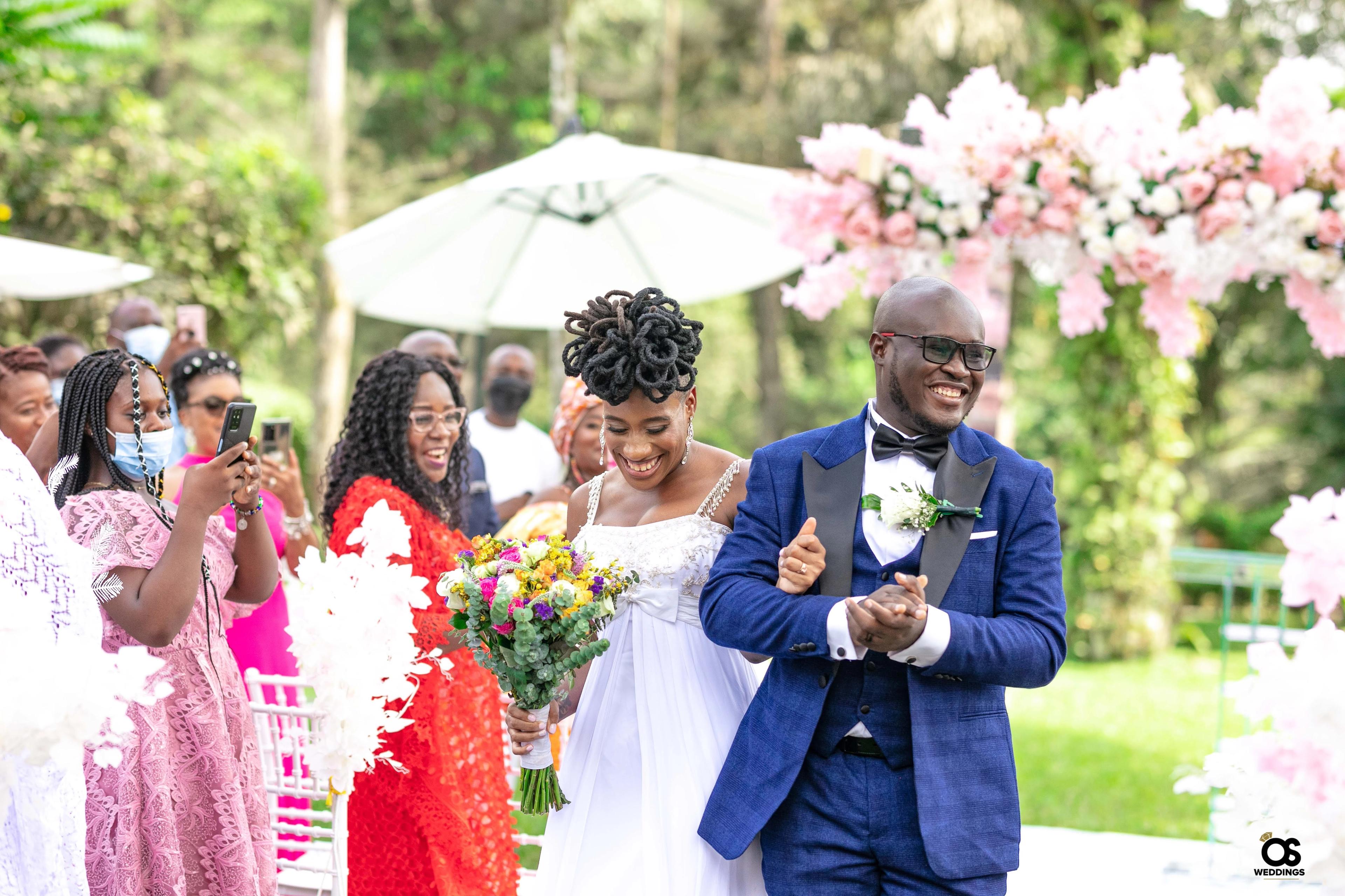 Bride and groom laughing together during portraits.