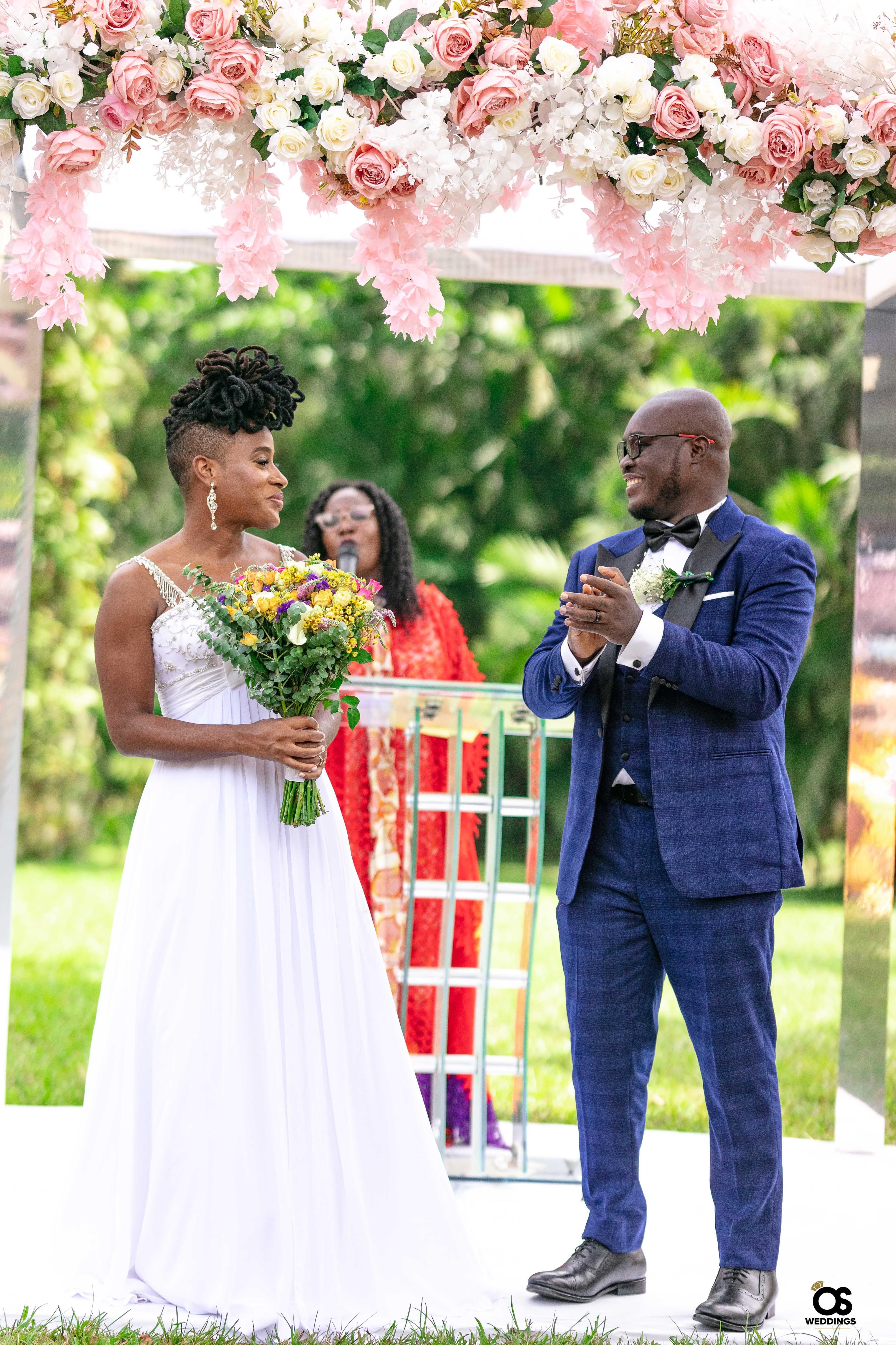 Bride and groom laughing together during portraits.