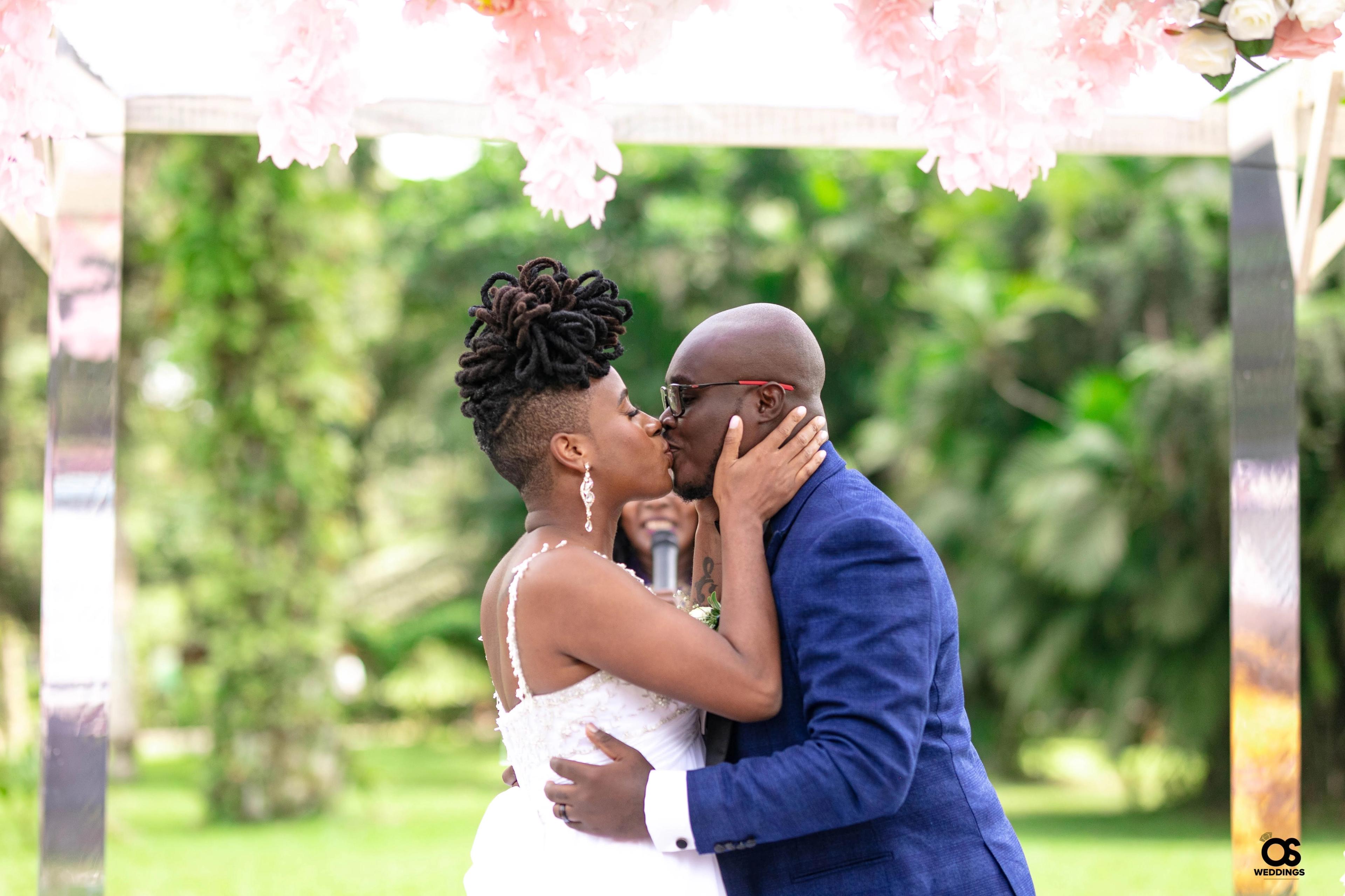 Bride and groom sharing a romantic moment during wedding portraits.