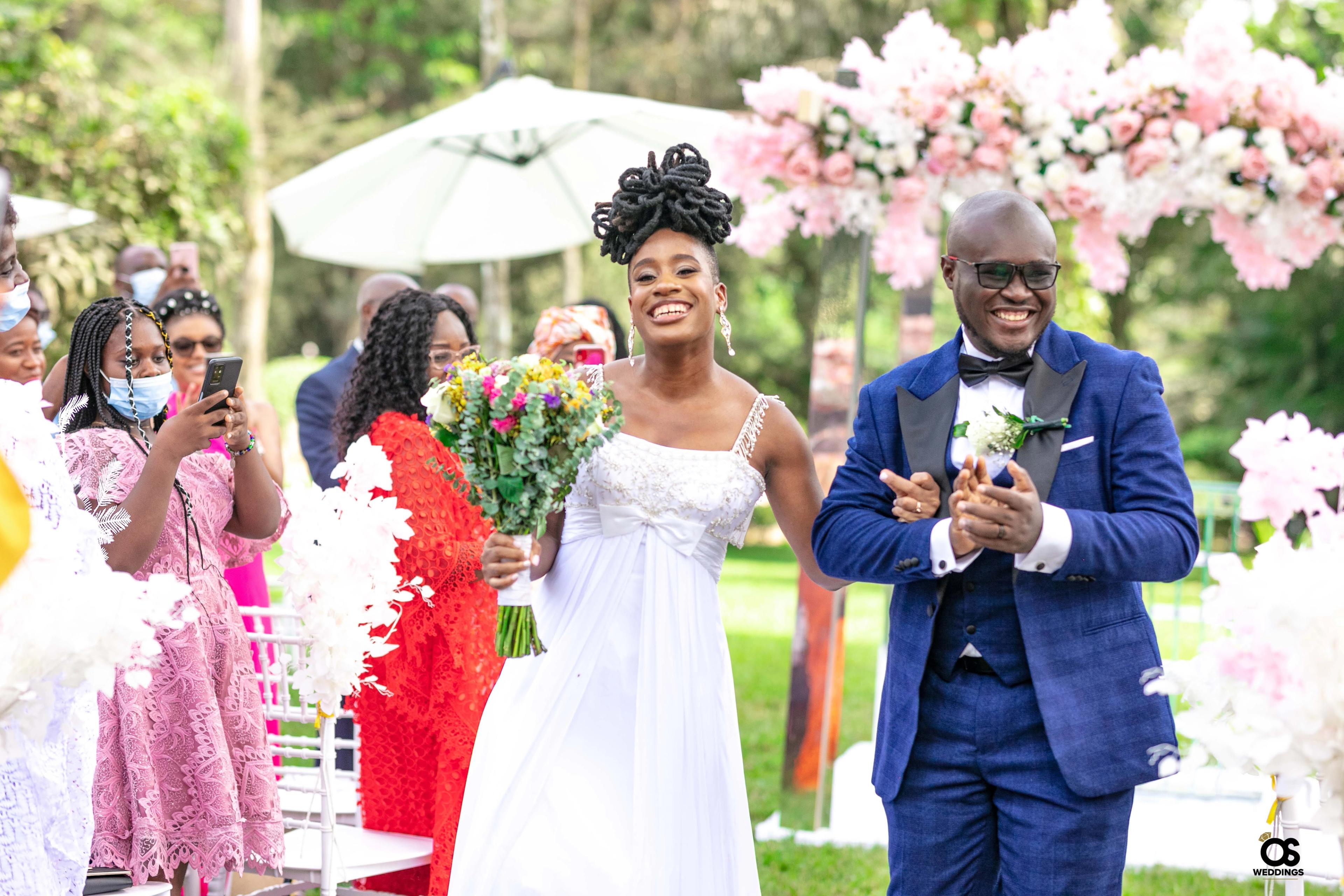 Bride and groom laughing together during portraits.
