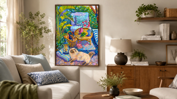 Afternoon Garden framed cat artwork hung as living room wall art above a wood console with books and plants