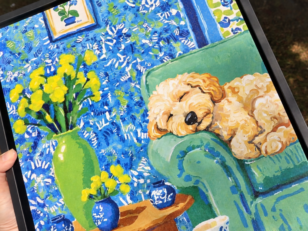 Close-up of a framed custom impressionist dog portrait printed on textured canvas