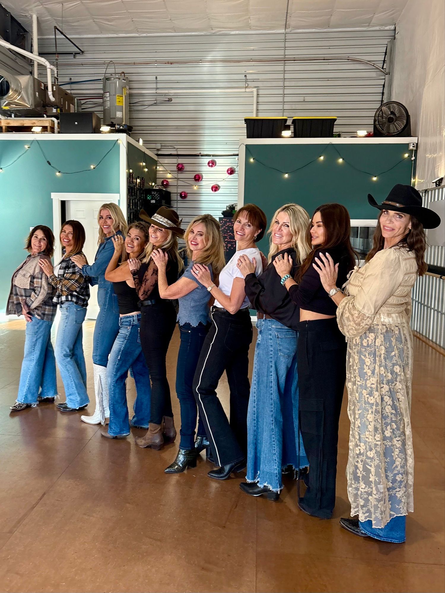A line of lovely ladies poses after a line dance class.