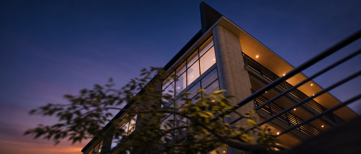 Dynamic low-angle cinematic render of a building at dusk, implying camera motion