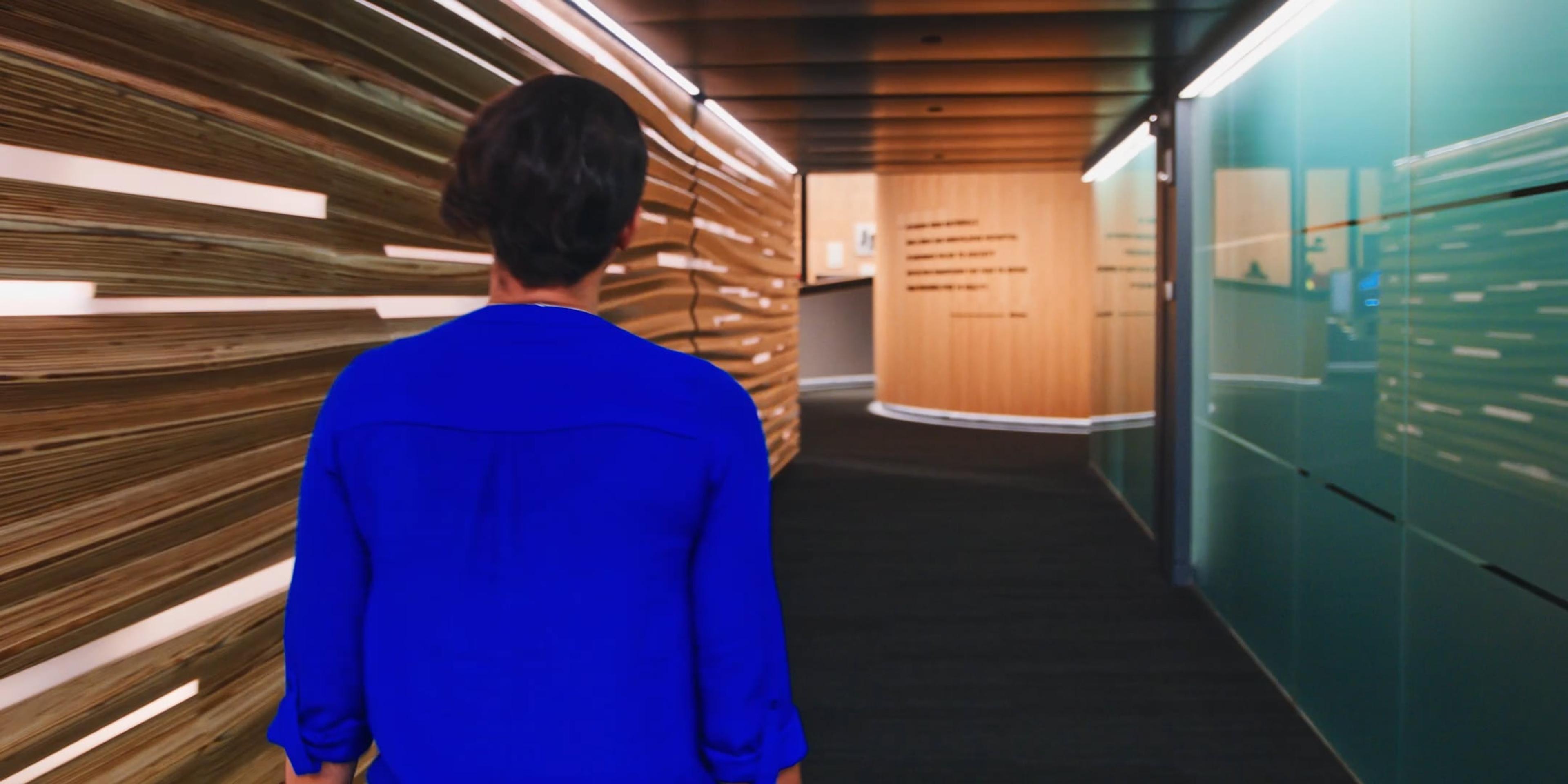 Sculptural corridor with custom-milled panels and motion-triggered lighting, leading to the central exhibition space. The design subtly introduces themes, materials, and visual effects recurring throughout the Capabilities Center.