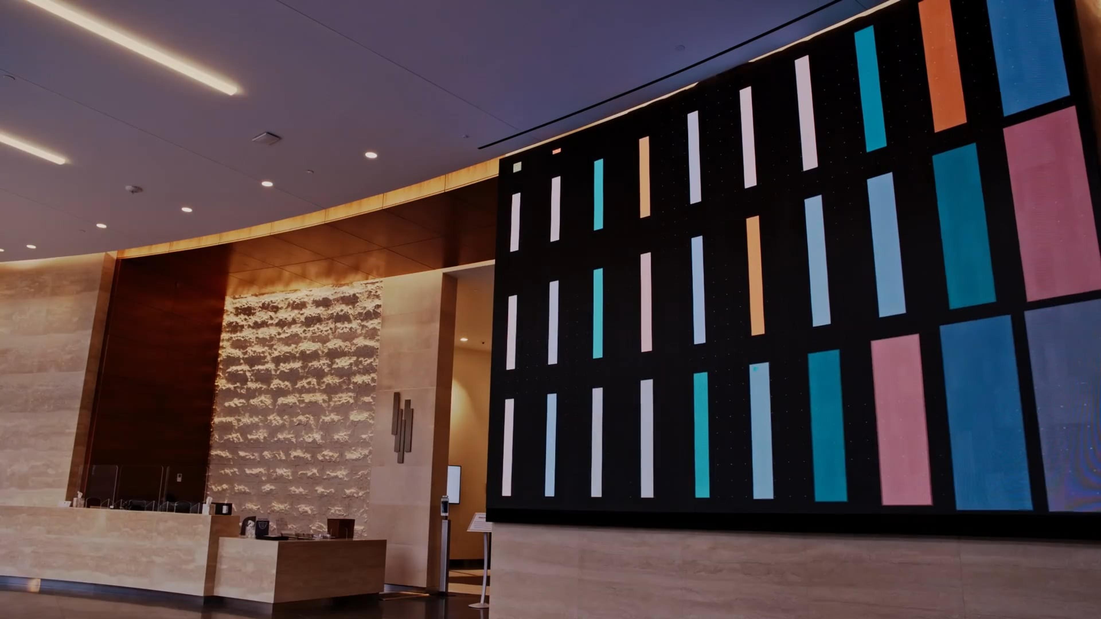 NAB's new HQ features engaging digital experiences: a 17x12 ft video wall and a five-panel touchscreen.