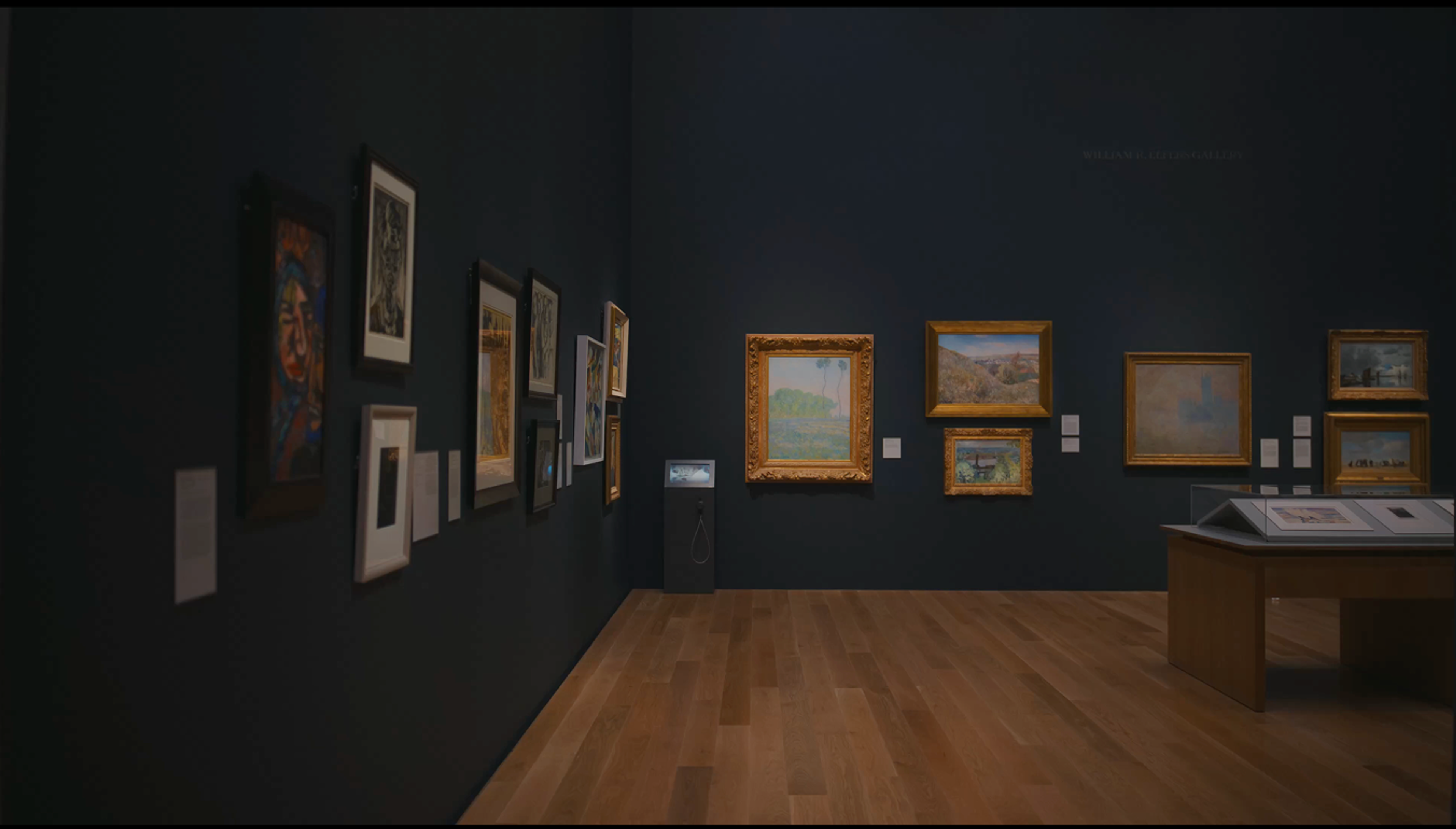 Visitors approach waist-height kiosks with small digital screens and tap to view, then raise audio cups to listen. 