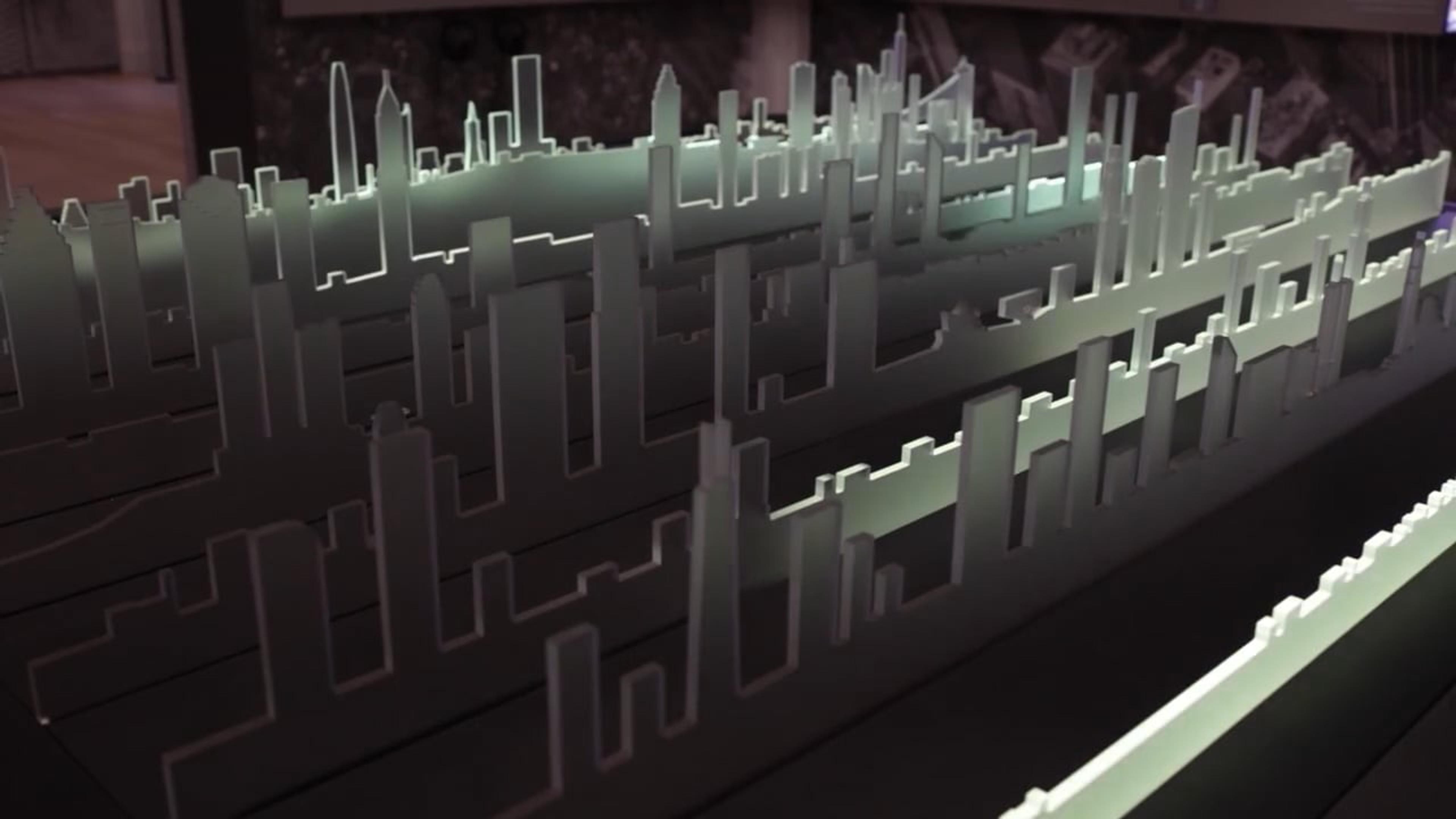 The Urban Media Table at NBM uses LED-lit acrylic skylines to display data on iconic American cities.