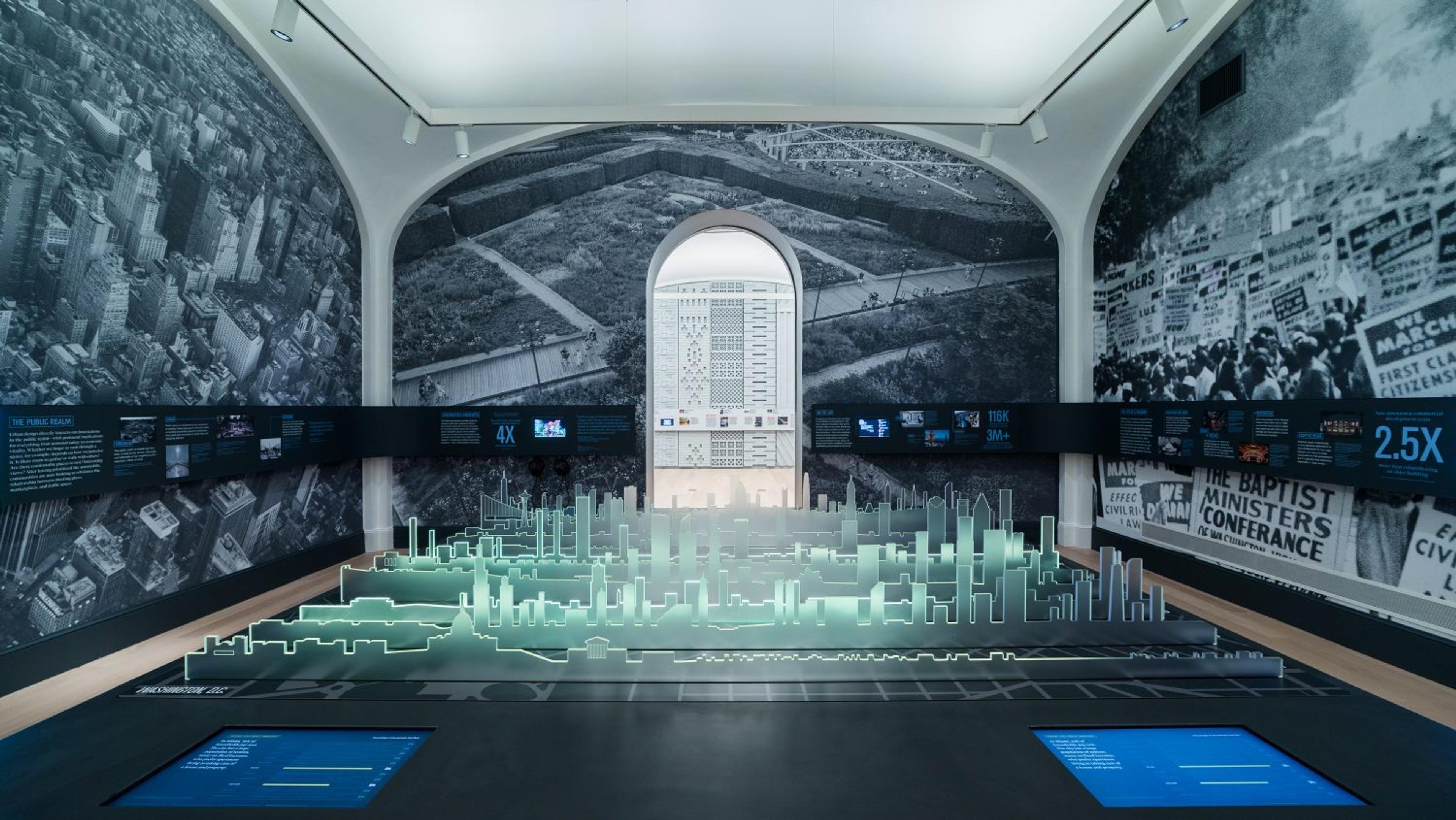 The Urban Media Table at NBM uses LED-lit acrylic skylines to display data on iconic American cities.