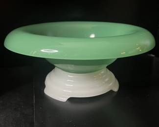 Pale green glass bowl with white pedestal base, featured among vintage glass and decorative pieces in a Beverly Hills estate sale.