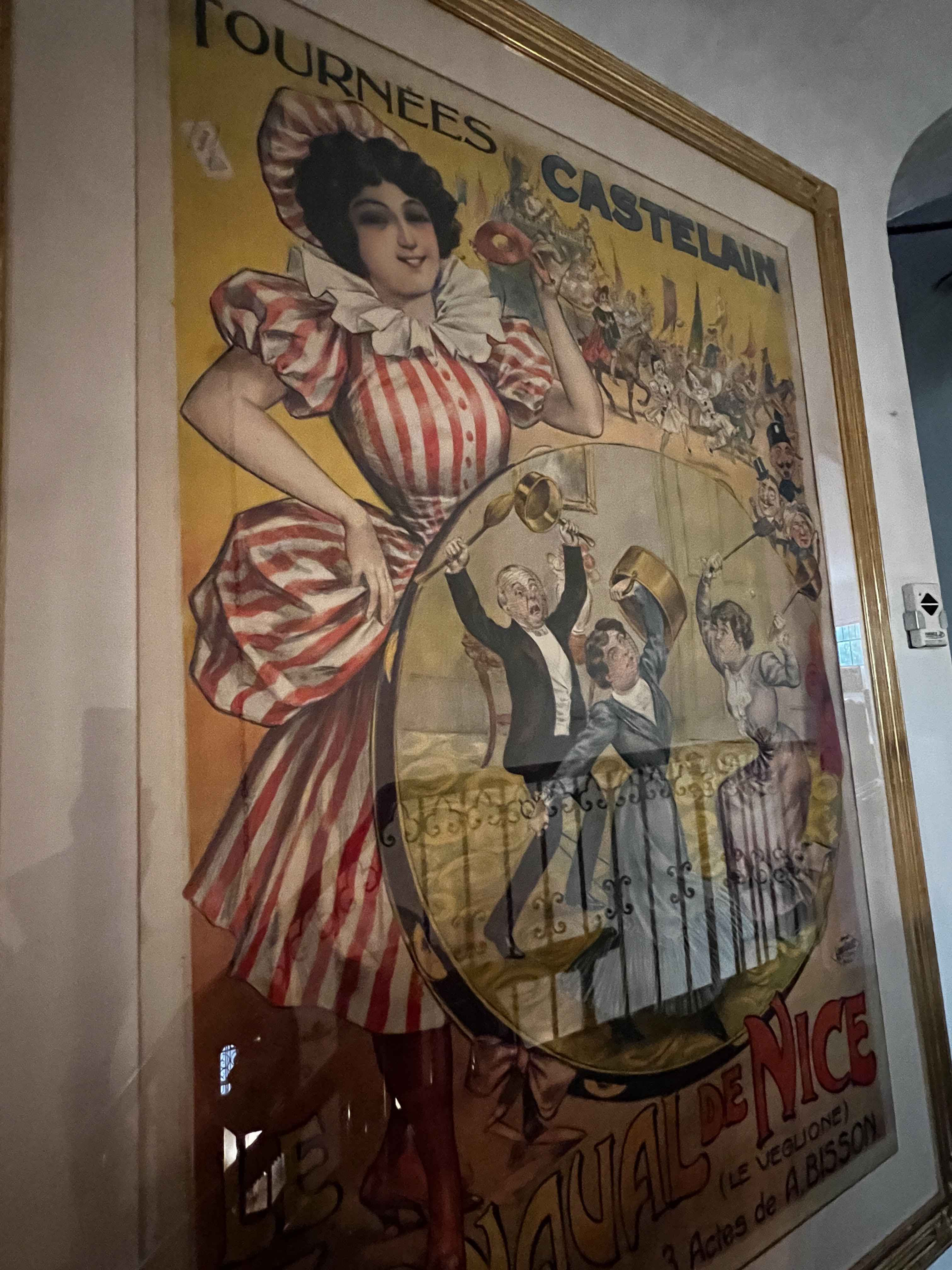 Large antique French theater poster in gold frame from a Hancock Park estate filled with art, antiques, and Hollywood decor.