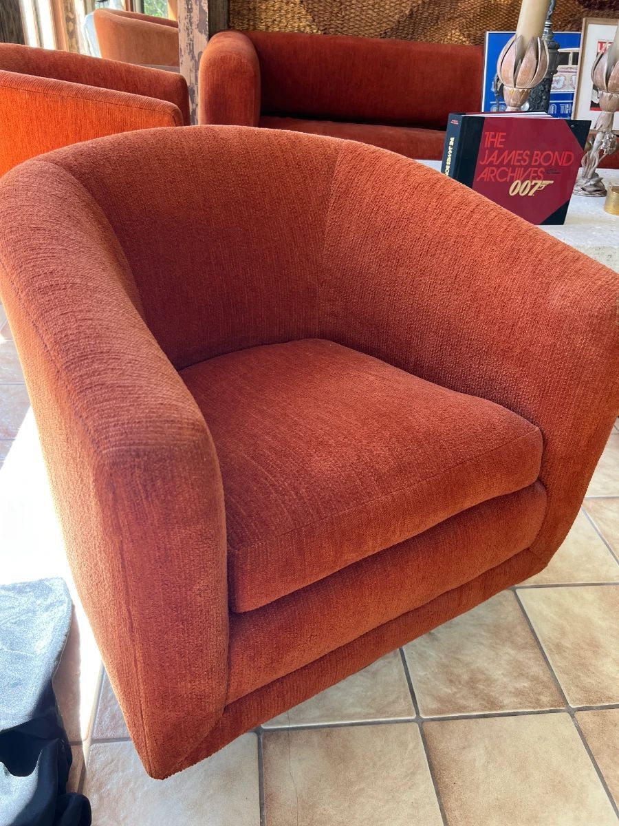 Chase Orange mid-century sectional sofa beneath a large woven wall tapestry from a Toluca Lake Hollywood insider estate sale.