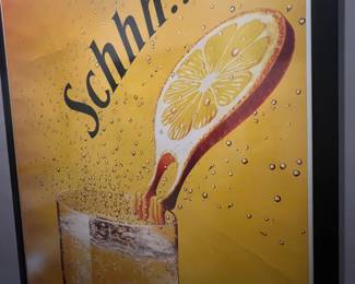 Framed vintage , featured among collectible advertising art in a Beverly Hills estate sale.