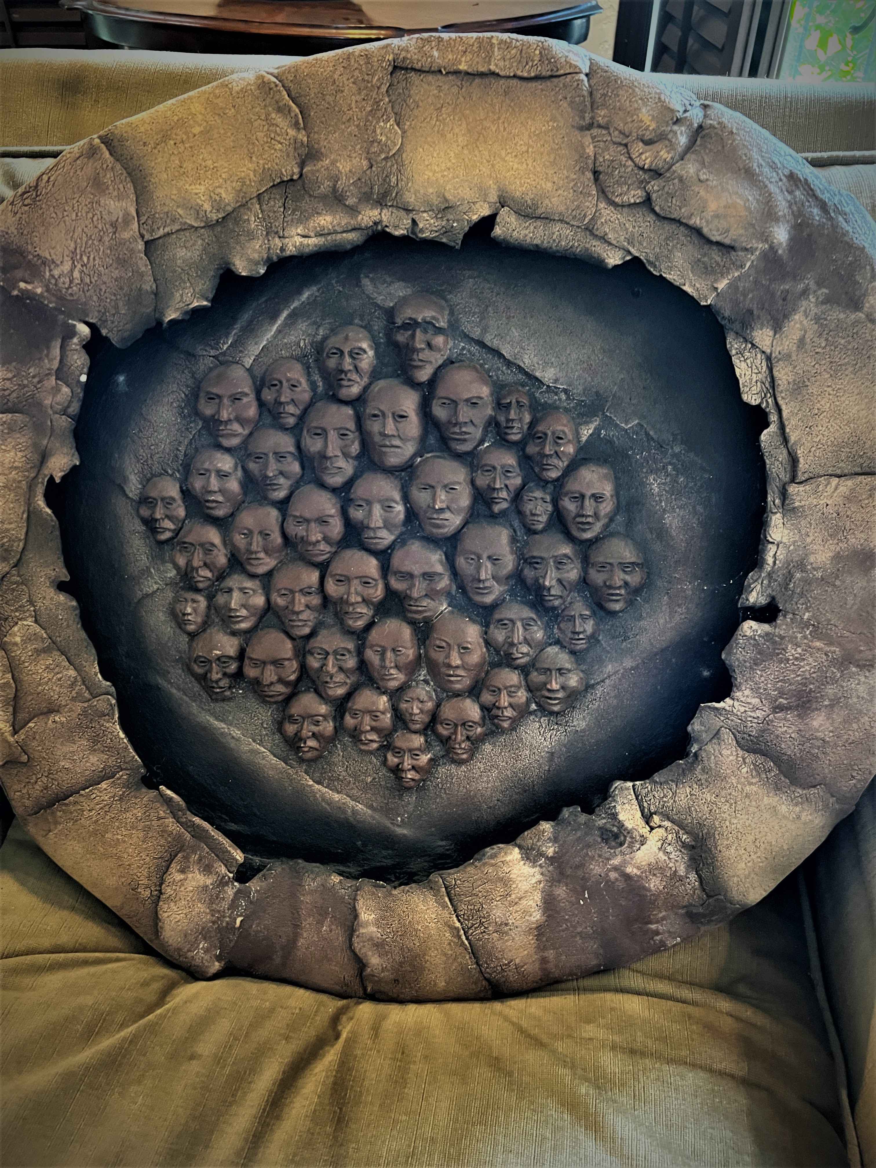 Large original sculptural wall art with multiple faces from a Hancock Park estate sale art collection.