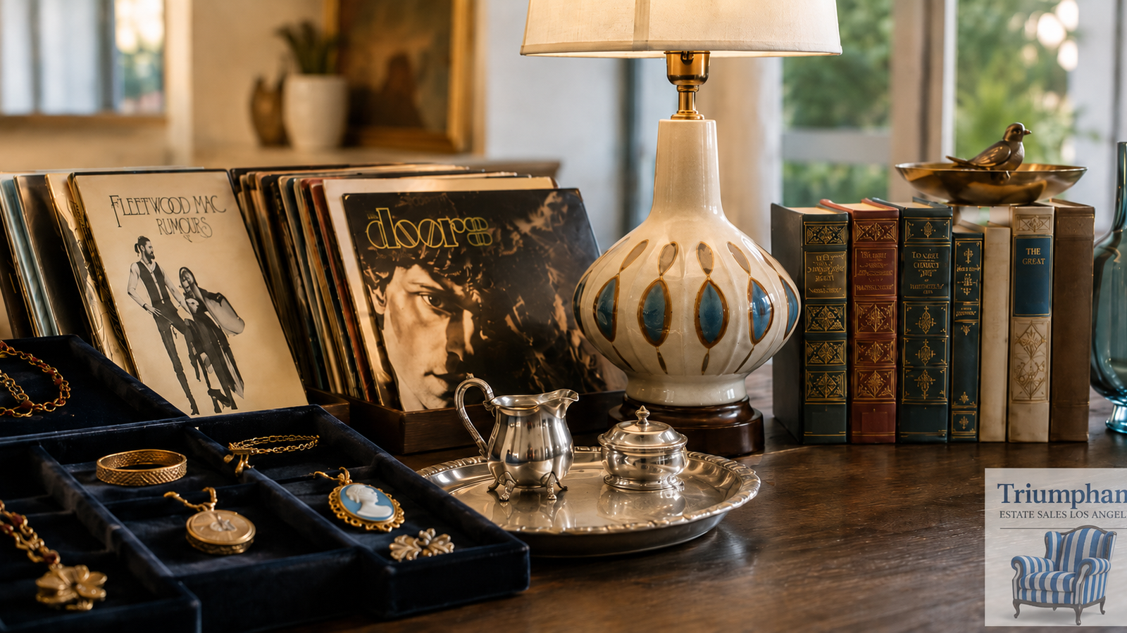 Vintage jewelry, vinyl records, mid-century ceramics, and collectible books displayed at a Los Angeles estate sale — Triumphant Estate Sales
