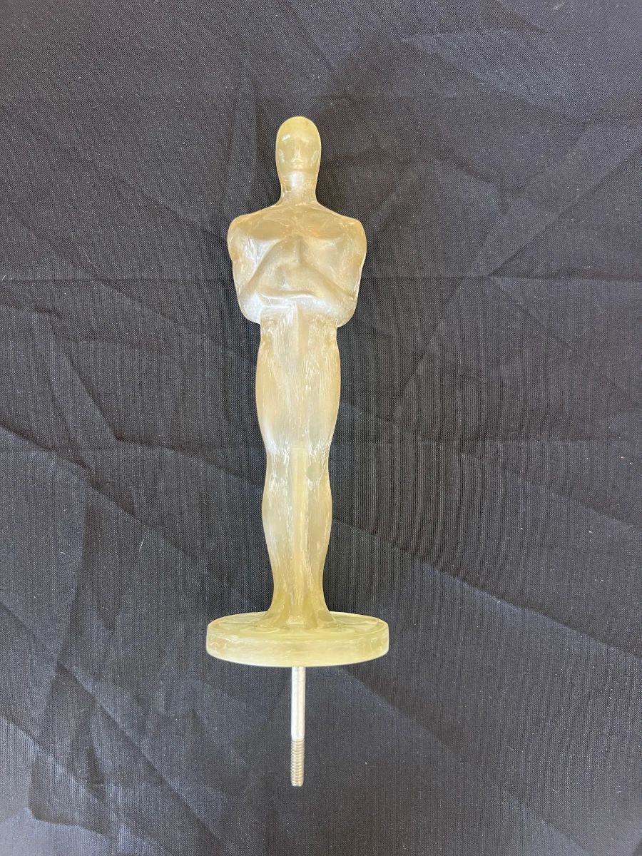 Oscar-style statuette mold or figure from a Toluca Lake Hollywood insider estate sale collection.