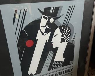 Framed black and white graphic art print with bold modern figure design, featured among art and prints in a Beverly Hills estate sale.