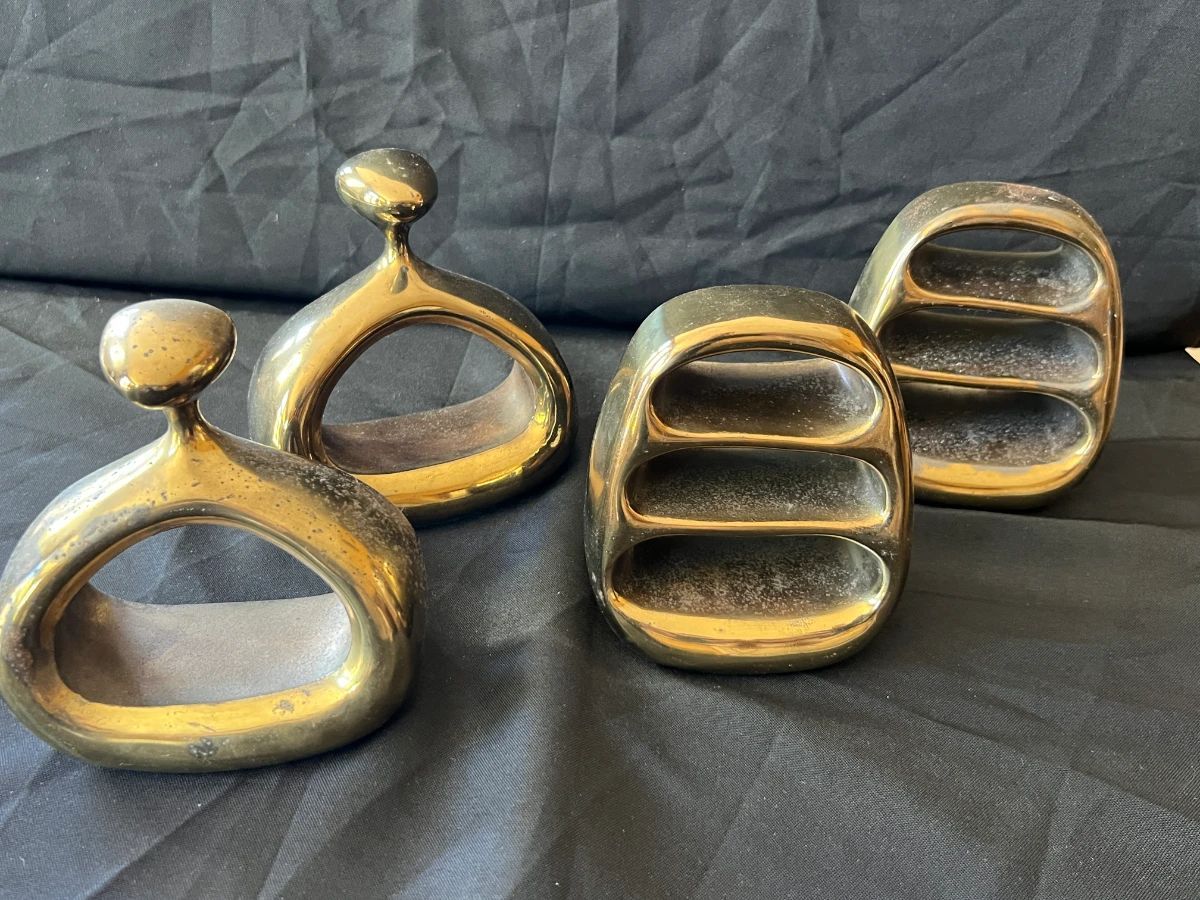 decorative desk pieces displayed on black fabric.